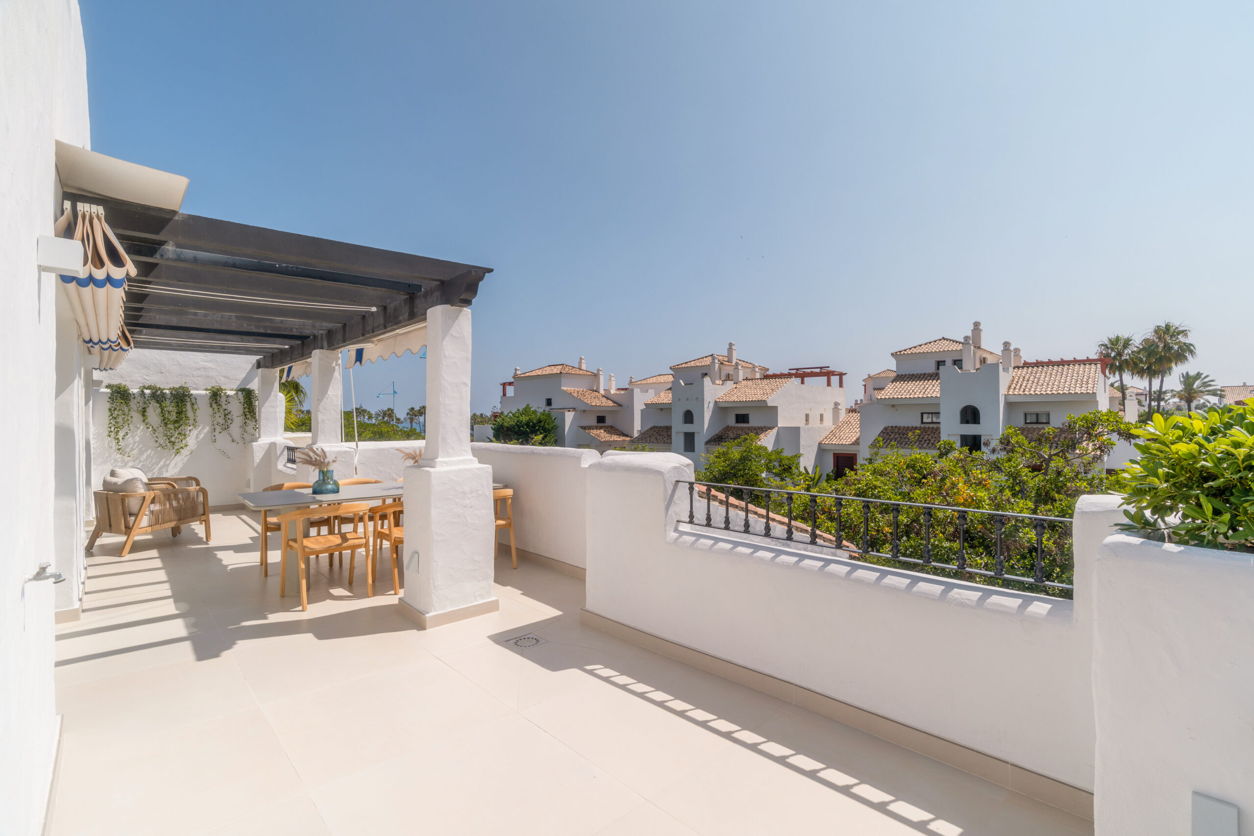 Spacious terrace of a 3-bedroom luxury apartment in San Pedro de Alcántara, Málaga—modern Costa del Sol property with sea views—Quintessentia Property Advisors