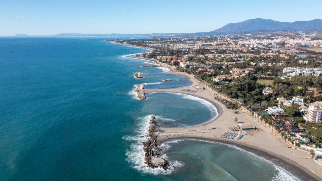 aerial view of the beach and landscape in Nueva Andalucia, —Quintessentia Property Advisors