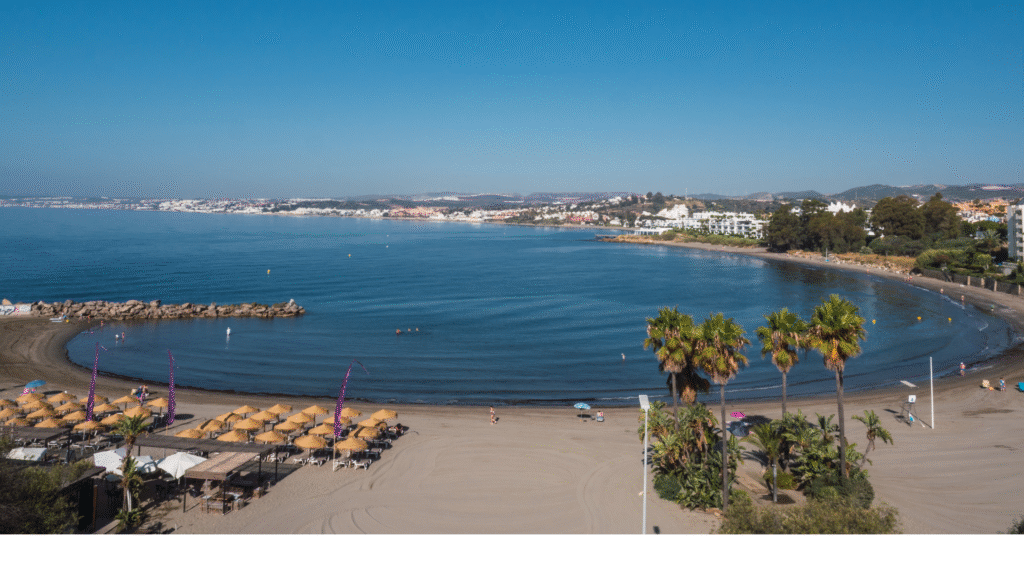 Aerial view of Playa del Cristo Beach in Estepona, Costa del Sol – Quintessentia Property Advisors