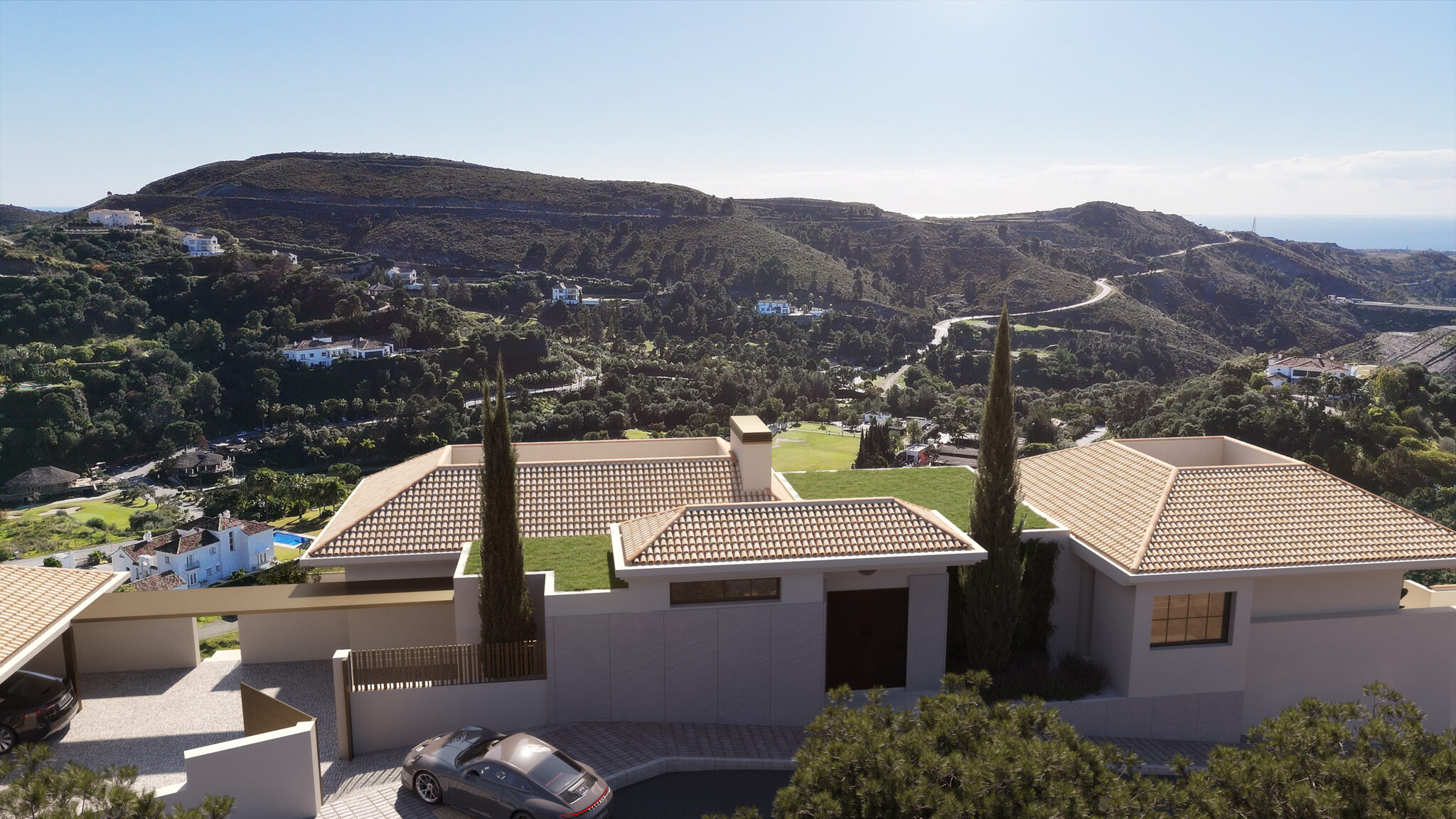 Aerial view of El Quejigal luxury villa entrance in Marbella Club Golf Resort Benahavís surrounded by mountains and golf course.