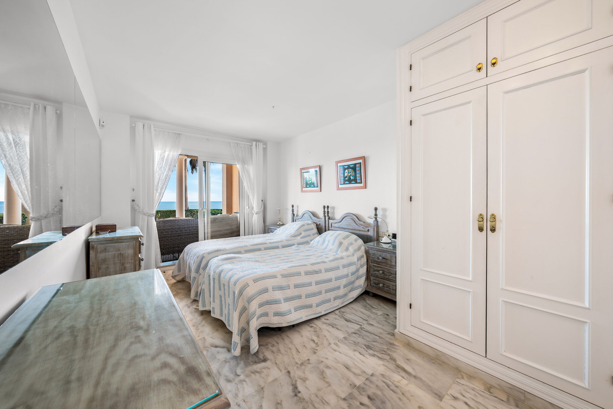 Master bedroom with built-in wardrobes in Estepona beachfront apartment