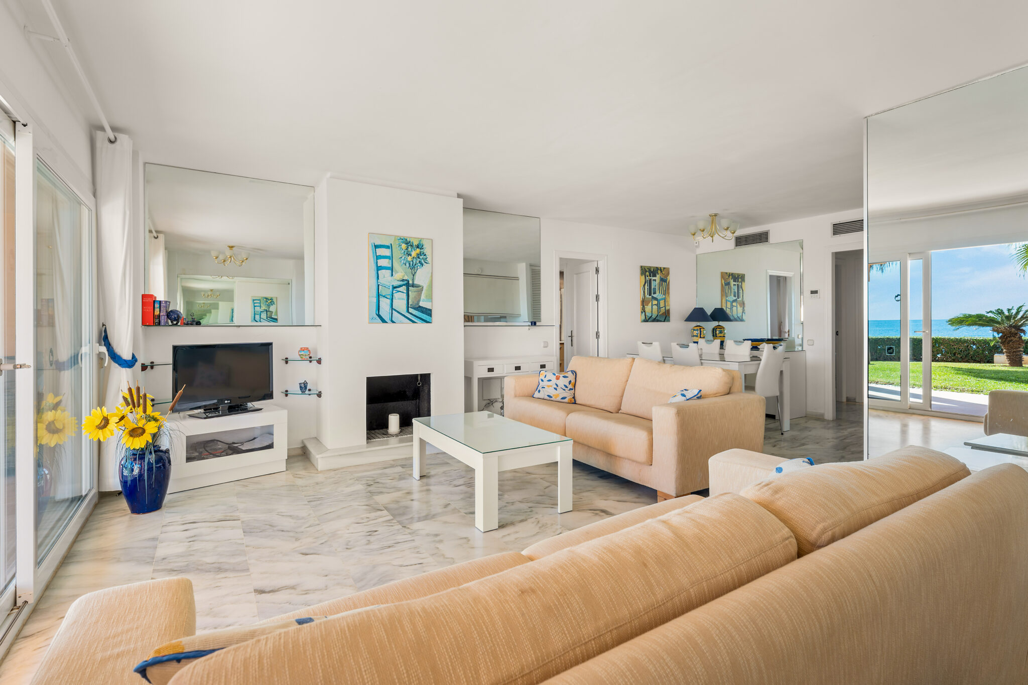 Spacious living room with natural light and terrace views in Estepona property