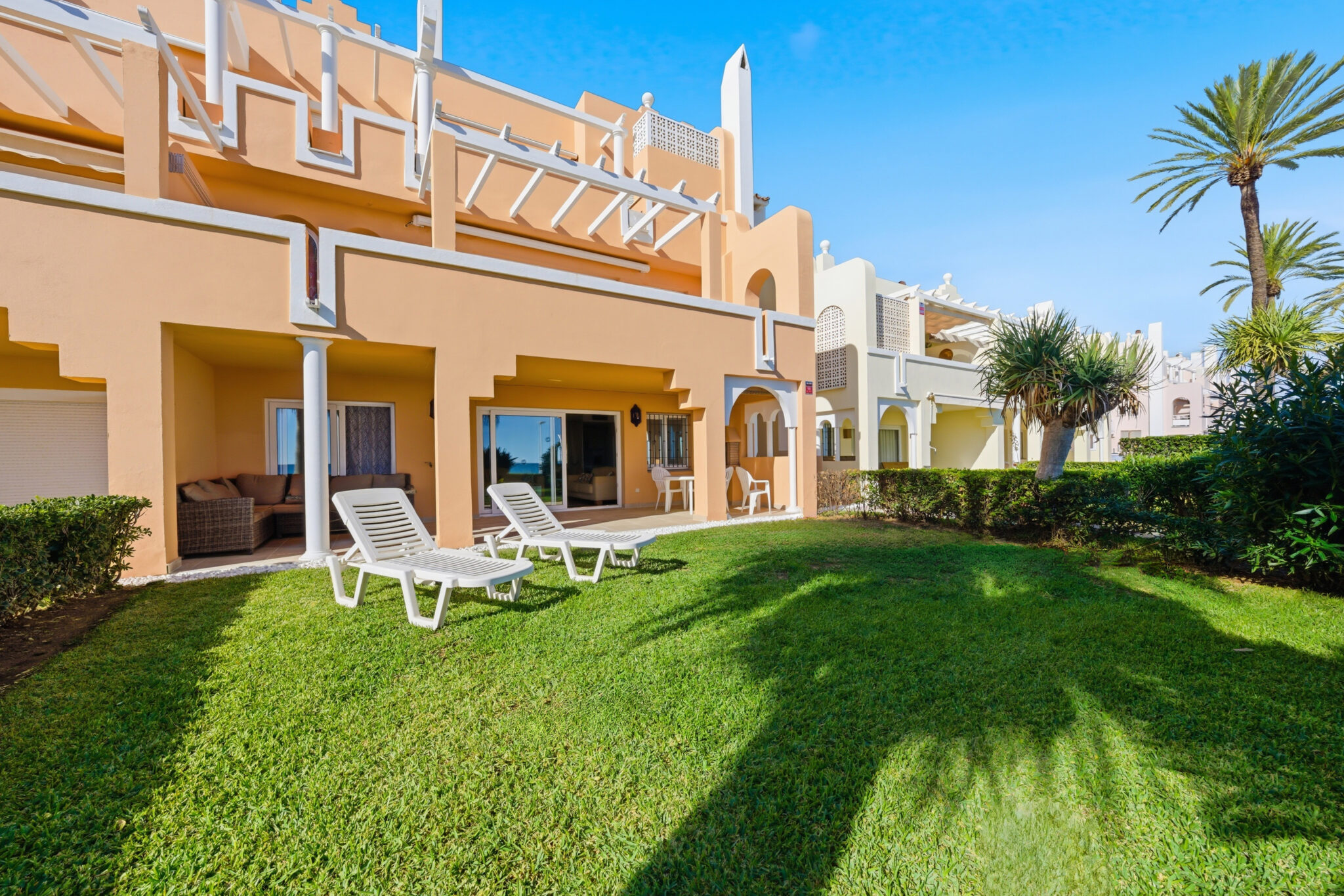 Private garden of beachfront apartment in Estepona West