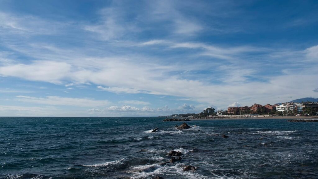 Coastal view of Nueva Andalucía, Marbella, showing the Mediterranean Sea and seaside properties along the Costa del Sol.