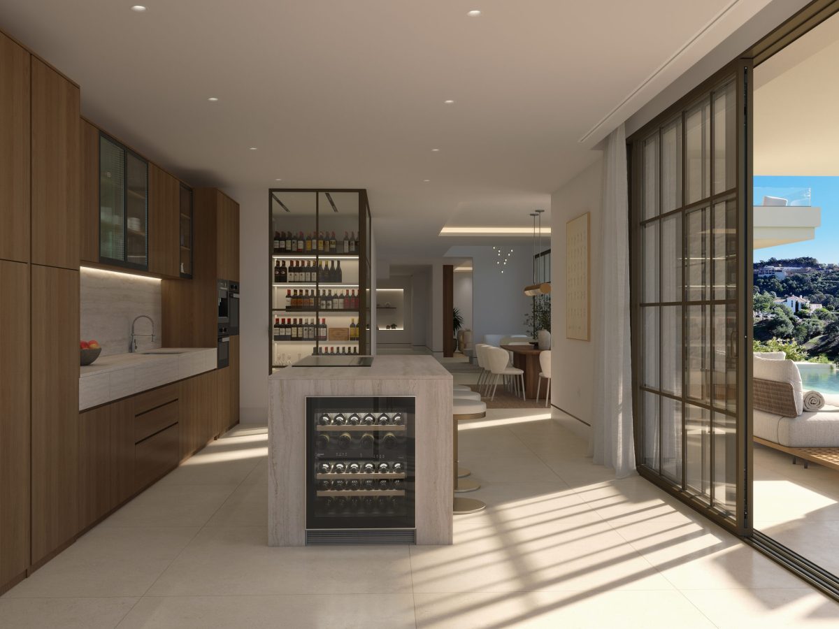 Luxury open-plan kitchen with wine cooler and terrace access in villa at Marbella Club Golf Resort Benahavís