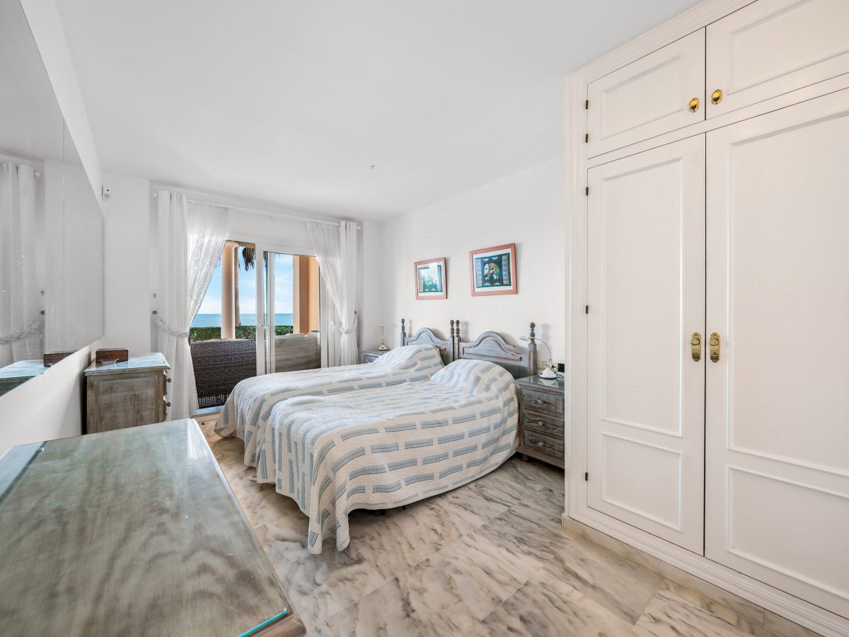 Master bedroom with built-in wardrobes in Estepona beachfront apartment