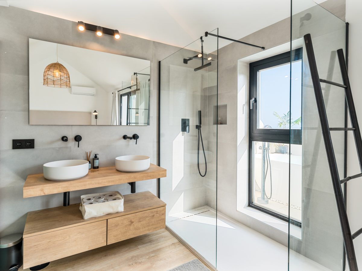 Contemporary bathroom with walk-in shower and double vanity at Los Pinos de Aloha, Marbella