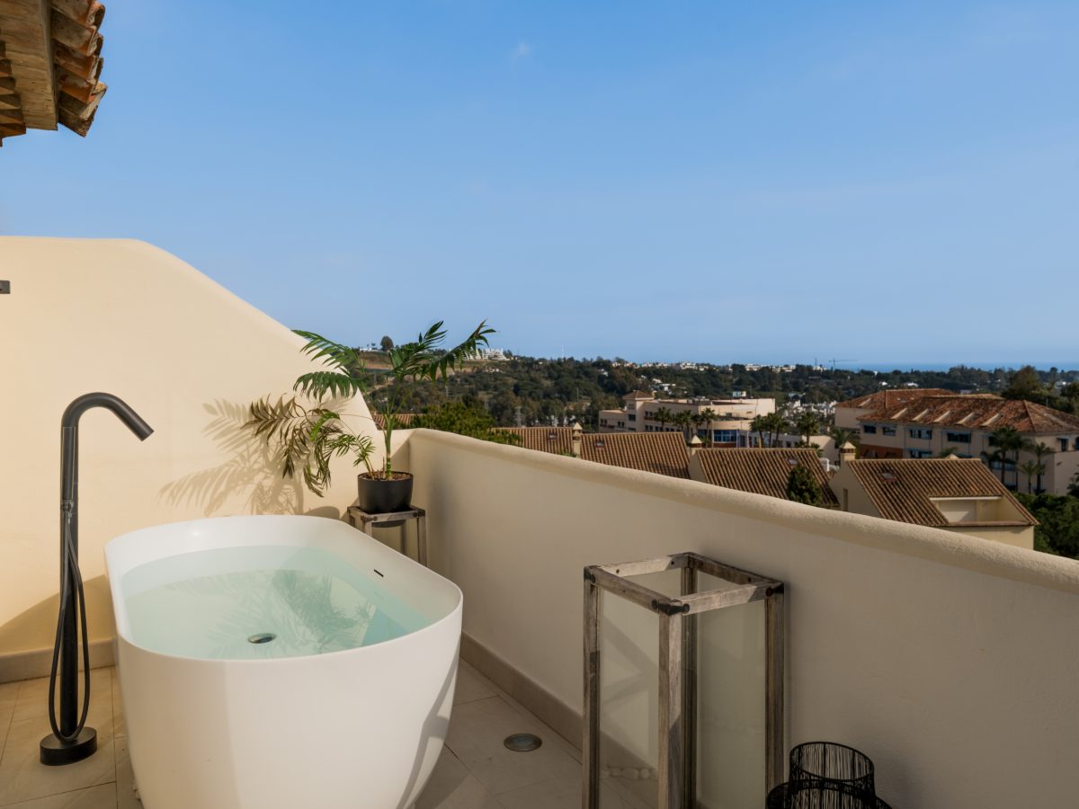Luxury rooftop terrace with outdoor bathtub and sea views in Los Pinos, Marbella.