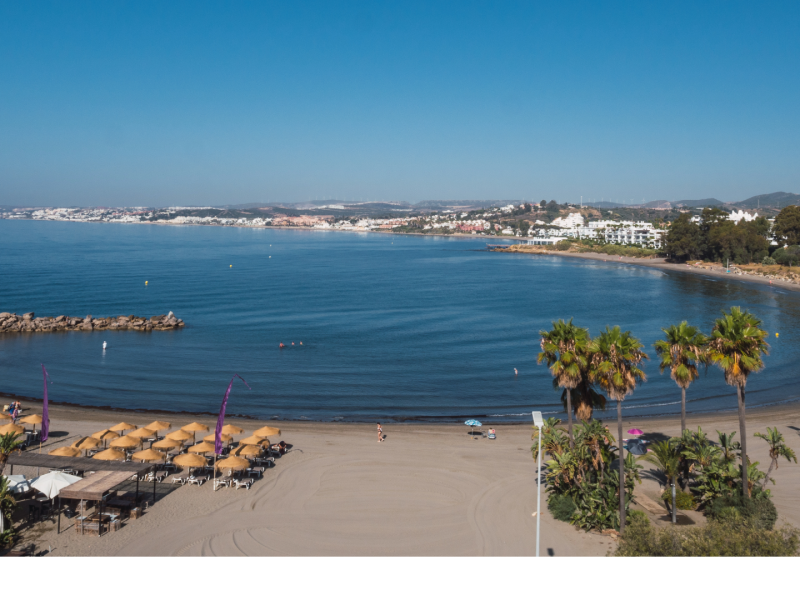 Aerial view of Playa del Cristo Beach in Estepona, Costa del Sol – Quintessentia Property Advisors