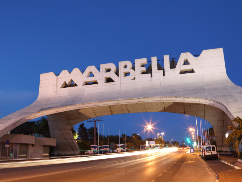 Marbella welcome arch at night, iconic entrance to the city.